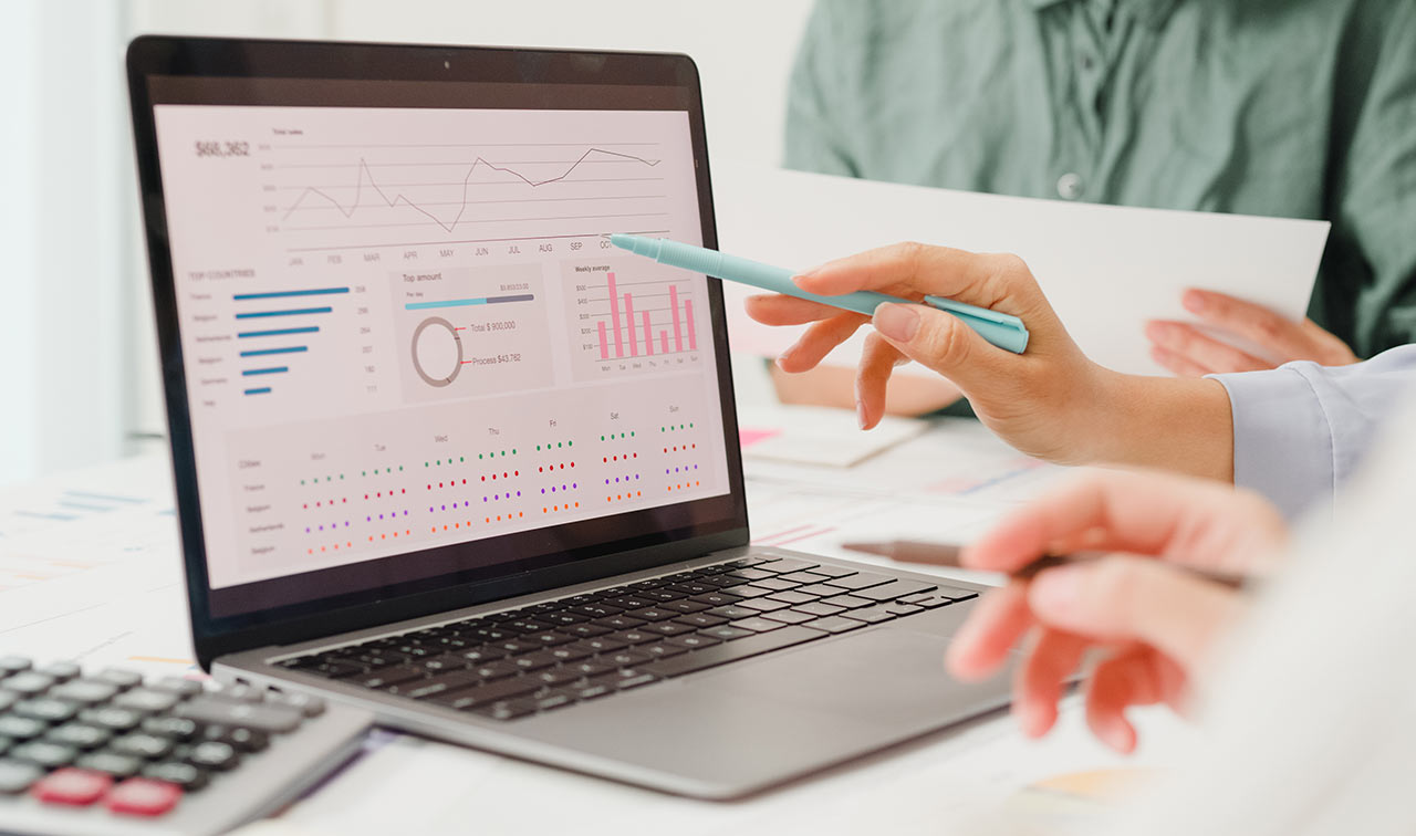 Person pointing at computer with stylus