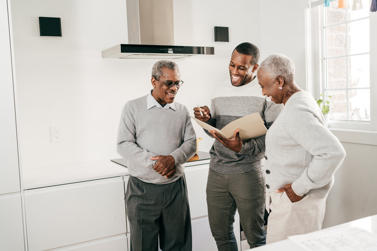 Family happily reviewing inheritance papers