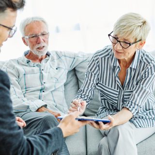 Retired couple meeting with financial advisor