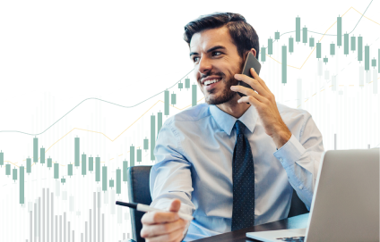 Male advisor on the phone, sitting in front of laptop